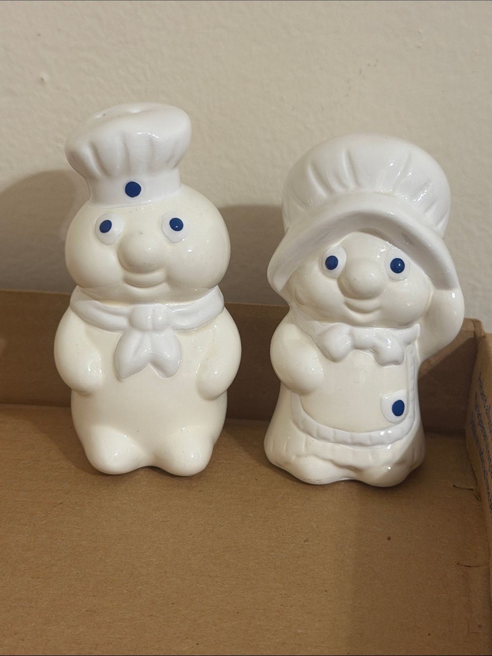 White Ceramic Salt and Pepper Shakers with Blue Accents